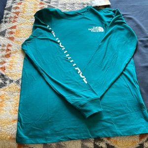 The North Face Men’s long sleeve shirt. Harbor blue color.